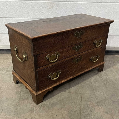 669 - A bachelor's chest of drawers, fitted two drawers below one faux front, in addition to carrying hand... 