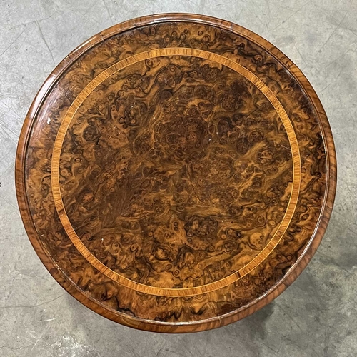 671 - A late Victorian burr walnut and crossbanded bookcase table, with a revolving display section, on tr... 