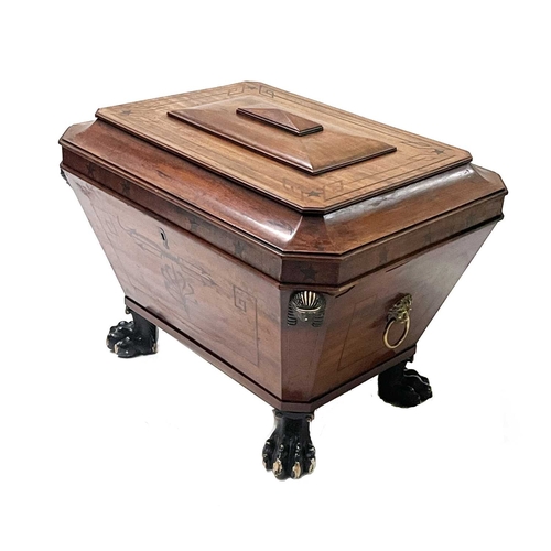 745 - A Regency mahogany cellarette, circa 1820, in the manner of Thomas Hope, of sarcophagus form with hi... 