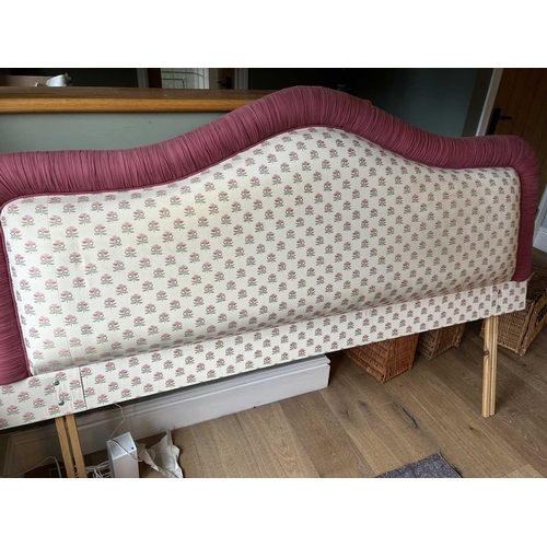 753 - A Colefax & Fowler Fernshaw Red upholstered serpentine top headboard and matching drapery with fring... 