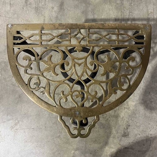 755 - A George III wrought iron and brass trivet. W: 32 cm D: 47 cm H: 40