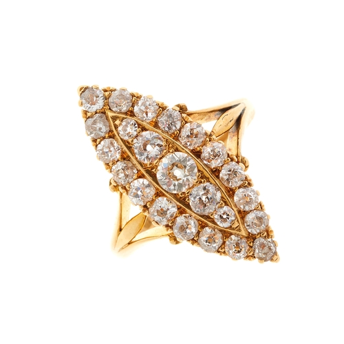 100 - An Edwardian 18ct gold old-cut diamond marquise-shape cluster dress ring, with stylised fleur-de-lys... 