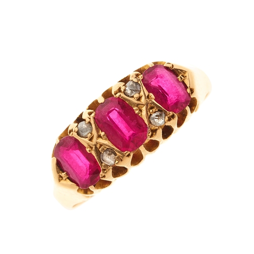 108 - An Edwardian 18ct gold ruby three-stone dress ring, with rose-cut diamond double spacers, hallmarks ... 
