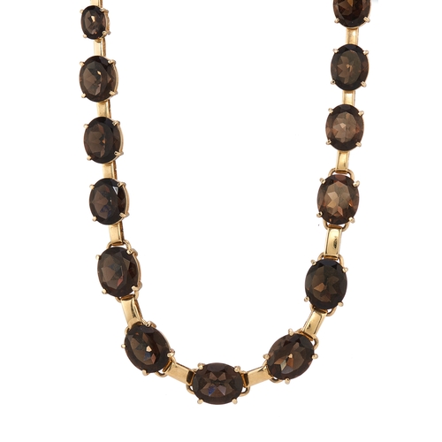 123 - A set of 14ct gold smoky quartz jewellery, to include a graduated riviere necklace, a line bracelet,... 