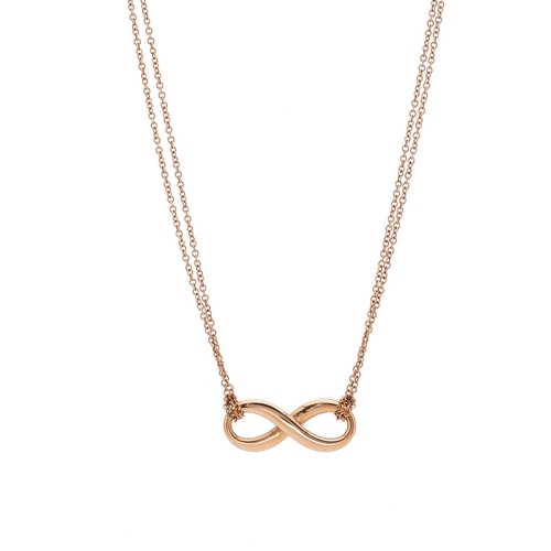 143 - Tiffany & Co., an 18ct gold Infinity pendant, suspended from a two-row trace-link chain, signed Tiff... 