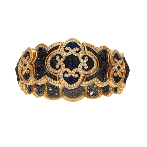 146 - Dimitrios Kapsaskis, a 22ct gold plated and silver, blue gem and cubic zirconia Pomegranate bracelet... 