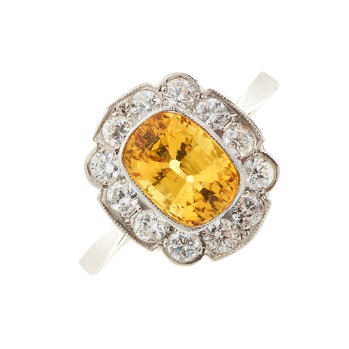 159 - A platinum yellow sapphire and diamond cluster ring, yellow sapphire estimated weight 2.10ct, estima... 