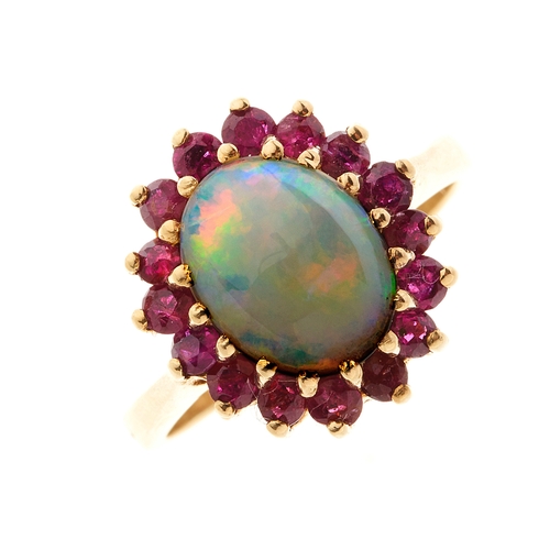 166 - A gold opal cabochon and ruby cluster dress ring, ring size N, 4.4g
