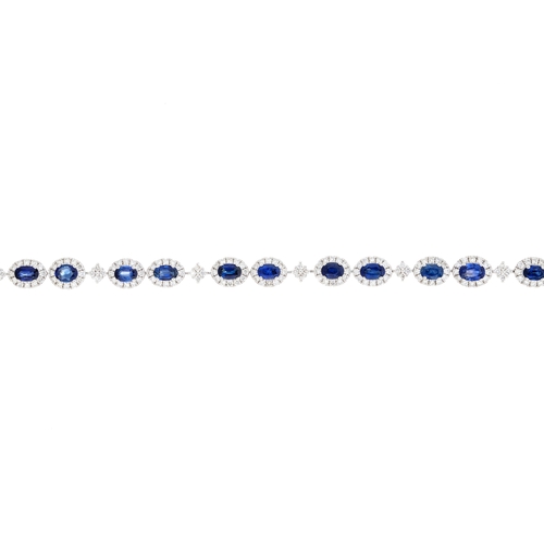 62 - An 18ct gold sapphire and brilliant-cut diamond line bracelet, with box clasp, total sapphire weight... 