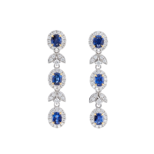 64 - A pair of 18ct gold sapphire and brilliant-cut diamond foliate cluster drop earrings, total sapphire... 