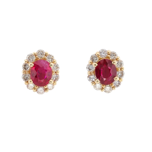 66 - A pair of 18ct gold ruby and brilliant-cut diamond cluster stud earrings, estimated total ruby weigh... 