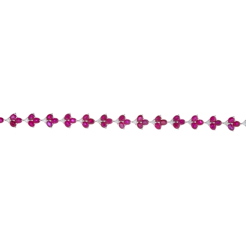 67 - An 18ct gold ruby and brilliant-cut diamond foliate line bracelet, estimated total ruby weight 12ct,... 