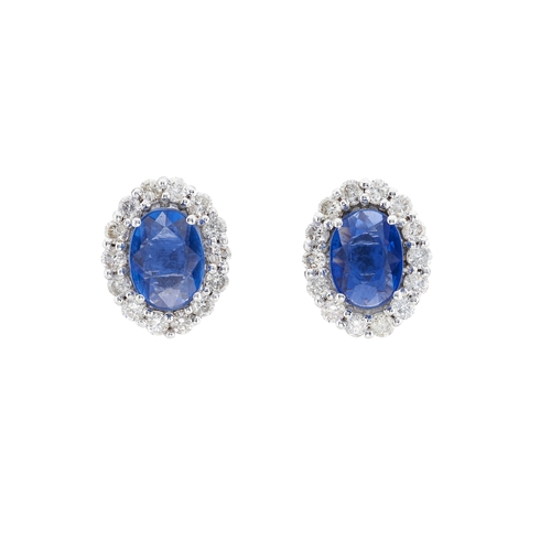 73 - A pair of 18ct gold sapphire and brilliant-cut diamond cluster stud earrings, estimated total sapphi... 