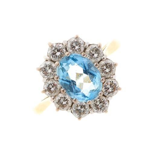 75 - An 18ct gold aquamarine and brilliant-cut diamond cluster dress ring, aquamarine estimated weight 1.... 