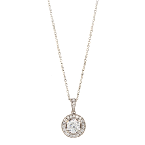 77 - An 18ct gold brilliant-cut diamond single-stone pendant, with similarly-cut diamond halo and surmoun... 