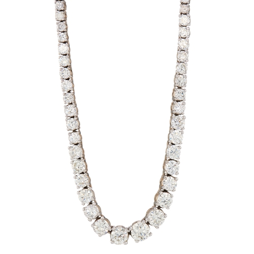 87 - An impressive graduated brilliant-cut diamond line riviere necklace, with push piece clasp and safet... 