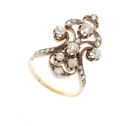 103 - A late Victorian gold and silver, old-cut diamond dress ring, of openwork scrolling design, estimate... 