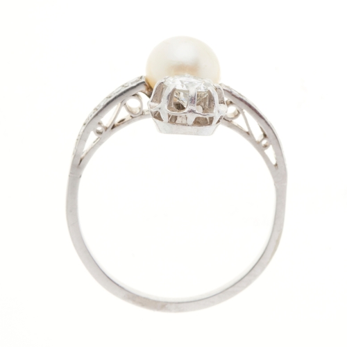 107 - A Belle Epoque diamond and pearl three-stone dress ring, estimated total diamond weight 0.80ct, H-I ... 