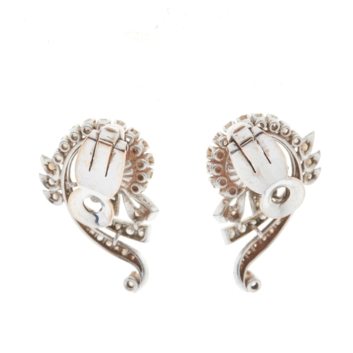 113 - A pair of mid 20th century cultured pearl and circular-cut diamond swirl clip earrings, estimated to... 