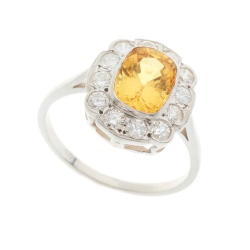159 - A platinum yellow sapphire and diamond cluster ring, yellow sapphire estimated weight 2.10ct, estima... 