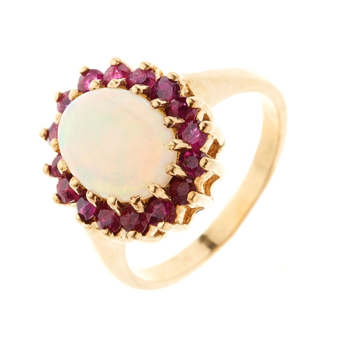 166 - A gold opal cabochon and ruby cluster dress ring, ring size N, 4.4g
