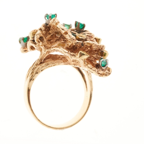172 - A gold emerald and diamond abstract dress ring, of asymmetric textured design, ring size N, 14.8g