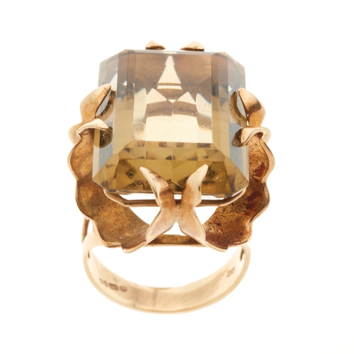 174 - A 1970s 9ct gold citrine single-stone cocktail ring, with fancy-shape claws, citrine estimated weigh... 