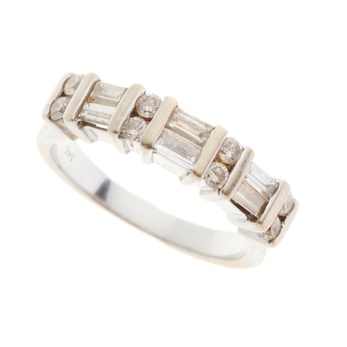 180 - A 14ct gold vari-cut diamond dress ring, with slightly tapered band, estimated total diamond weight ... 