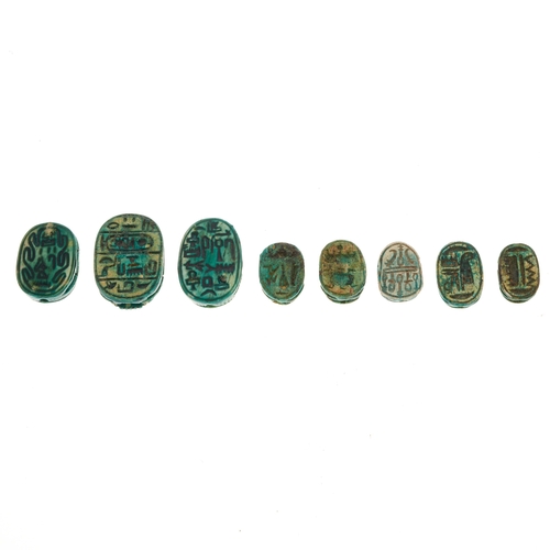 39 - A selection of eight Egyptian Revival faience scarab beetles, lengths 1.4 to 2.2cm, total weight 20.... 