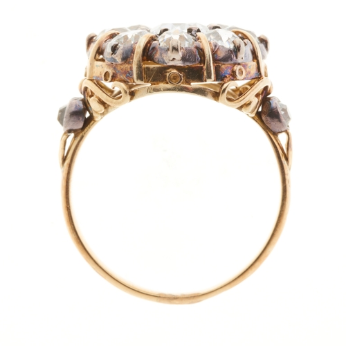 46 - A 19th century gold and silver, old-cut diamond cluster ring, with similarly-cut diamond accent shou... 