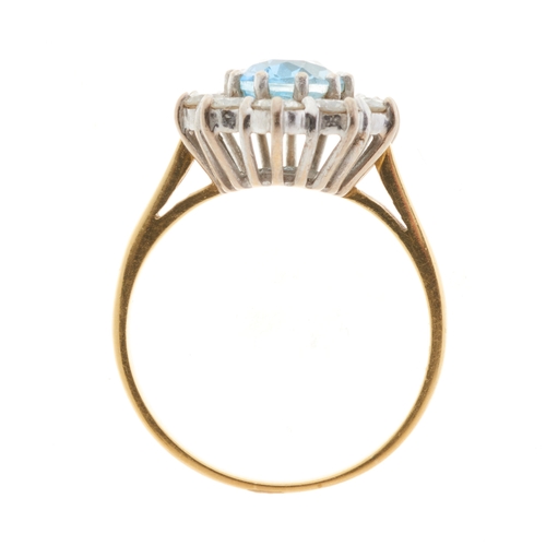 75 - An 18ct gold aquamarine and brilliant-cut diamond cluster dress ring, aquamarine estimated weight 1.... 