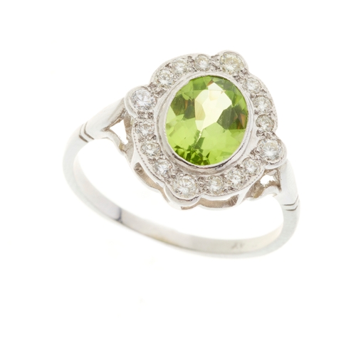 78 - A platinum peridot and diamond cluster dress ring, peridot estimated weight 1.35ct, estimated total ... 