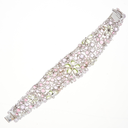 81 - An 18ct gold brilliant-cut diamond accent and multi-gem floral openwork bracelet, set throughout wit... 