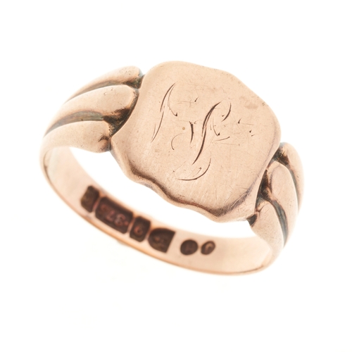 9 - An Edwardian 9ct gold shield-shape signet ring, with grooved shoulders, hallmarks for Chester 1903, ... 