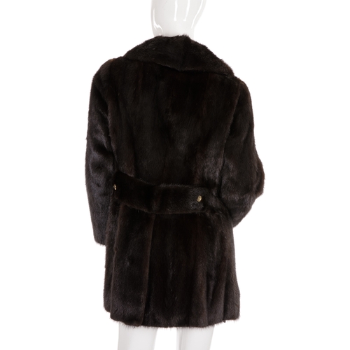 500 - A three-quarter length dark ranch mink jacket, featuring a notched lapel collar, front button fasten... 