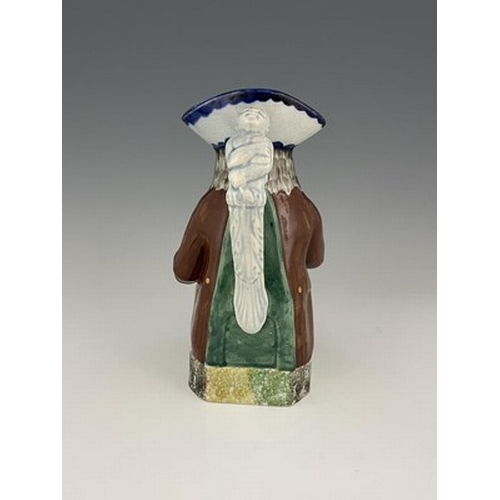 1001 - A Mexborough Toby jug, modelled holding a jug and a beaker, caryatid figural handle, sponge decorate... 