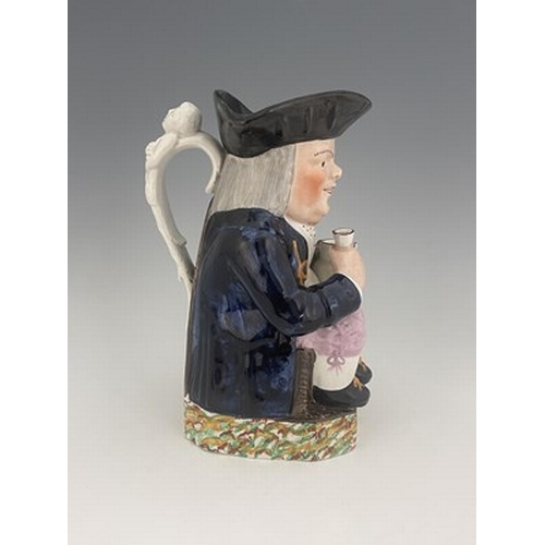 1003 - A Mexborough Toby jug, modelled holding a jug and a beaker, caryatid figural handle, black hat and s... 