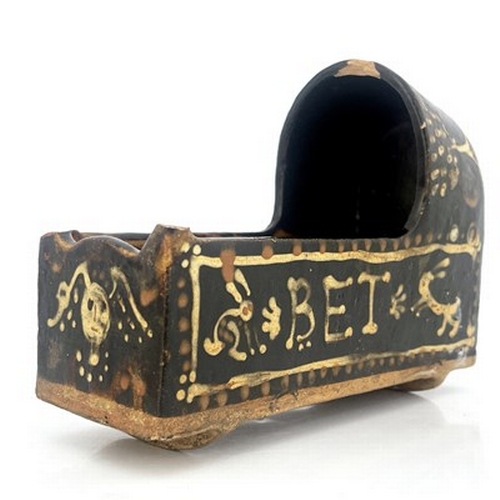 1006 - A Yorkshire slipware model cradle, 19th century, slab construction, decorated with names Bob and Bet... 