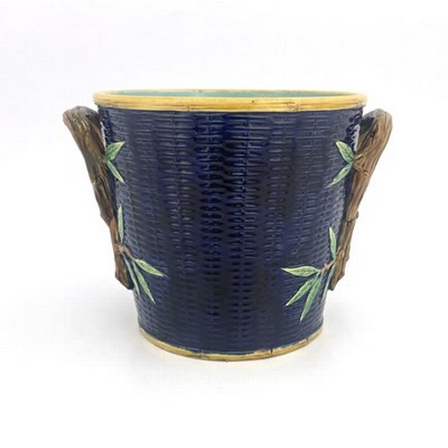 1007 - George Jones, a majolica jardiniere, modelled as a woven basket with knotted branch handles, turquoi... 