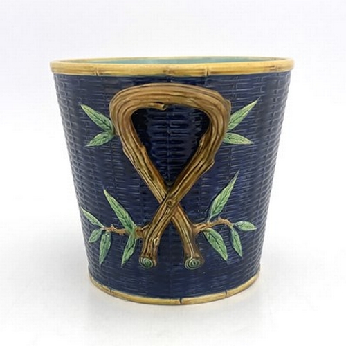 1007 - George Jones, a majolica jardiniere, modelled as a woven basket with knotted branch handles, turquoi... 