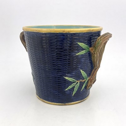 1007 - George Jones, a majolica jardiniere, modelled as a woven basket with knotted branch handles, turquoi... 