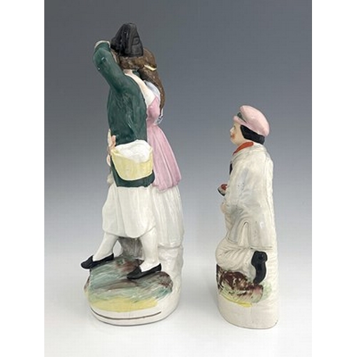 1016 - A Staffordshire figure group, late nineteenth-century, 'Fisherman and Companion' figure modelled as ... 