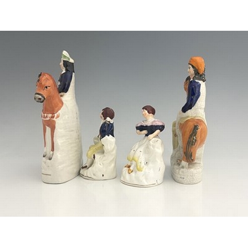 1018 - A Staffordshire figure group, circa 1850, modelled as two figures mounted on horseback, likely to be... 