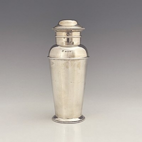 102 - An Art Deco silver cocktail shaker, Adie Brothers, Birmingham 1929, shouldered milk churn form with ... 