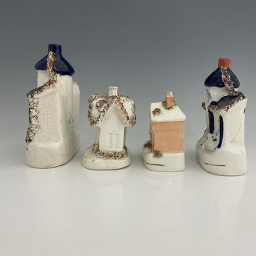 1020 - A Staffordshire figure group of cottages, 19th century, polychrome enamel painted with gilded highli... 