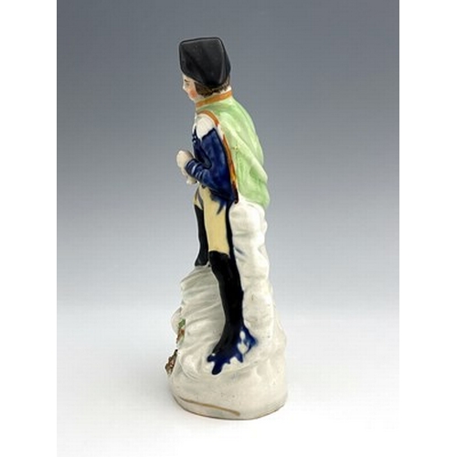 1022 - A Staffordshire portrait figure of Napoleon, circa 1840, modelled in military uniform and bicorn hat... 