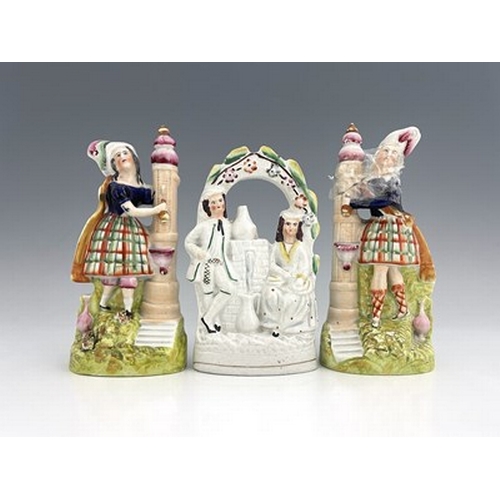 1027 - Staffordshire temperance figures collecting water from a fountain, circa 1860, figures modelled as a... 