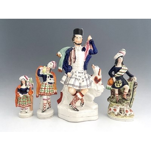 1030 - Four Staffordshire figure groups, circa 1850, including a shepherd figure holding a crook and pigski... 