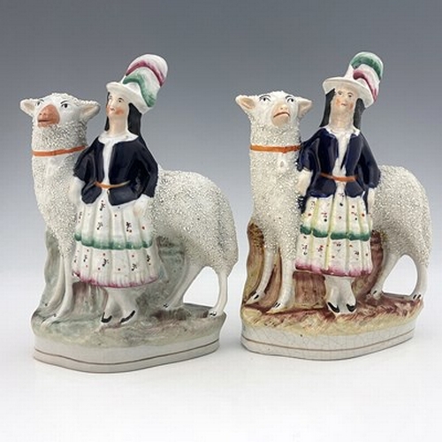 1039 - A pair of Staffordshire figures of royal children with sheep, circa 1860, modelled as royal portrait... 