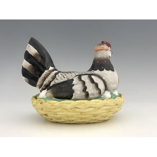 1040 - A Staffordshire pottery hen on nest, circa 1850, yellow basket dish base with cover modelled as a si... 